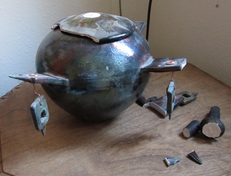 broken lidded vase