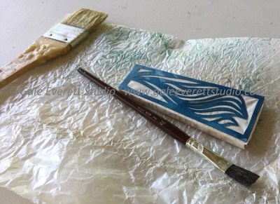 Cut paper attached to balsa wood frame and dried. Ready for wax application